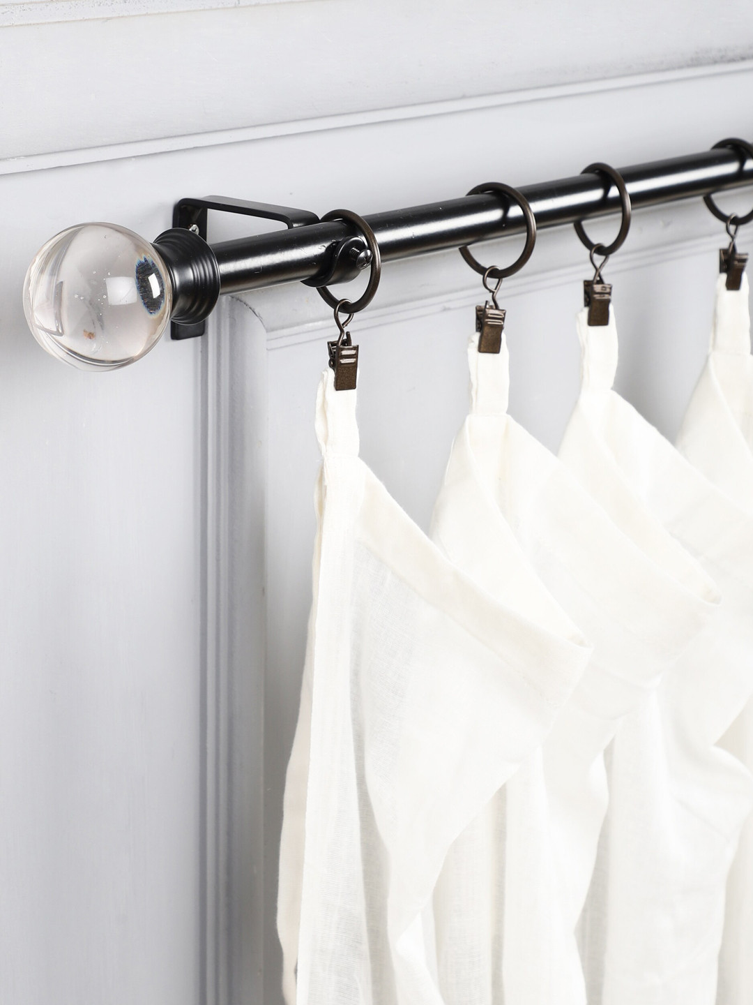 

The Decor Mart Black & Transparent Solid Curtain Rods With Hooks