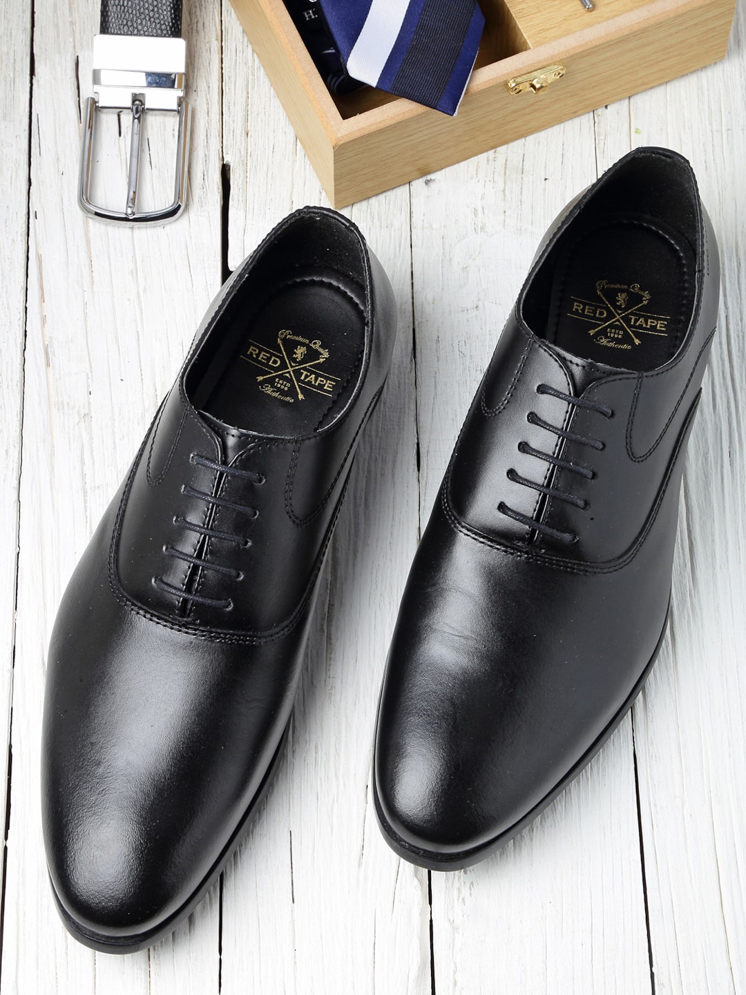 

Red Tape Men Black Solid Leather Formal Oxfords
