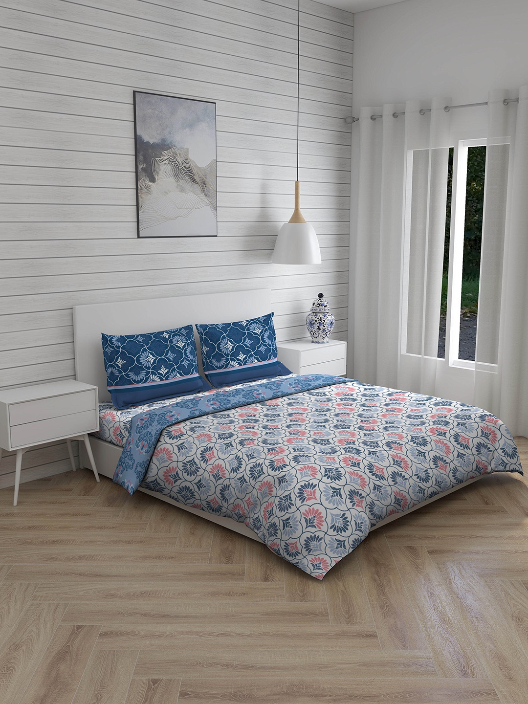 

Layers Blue Printed Double Queen Bedsheet With 2 Pillow Covers & Comforter