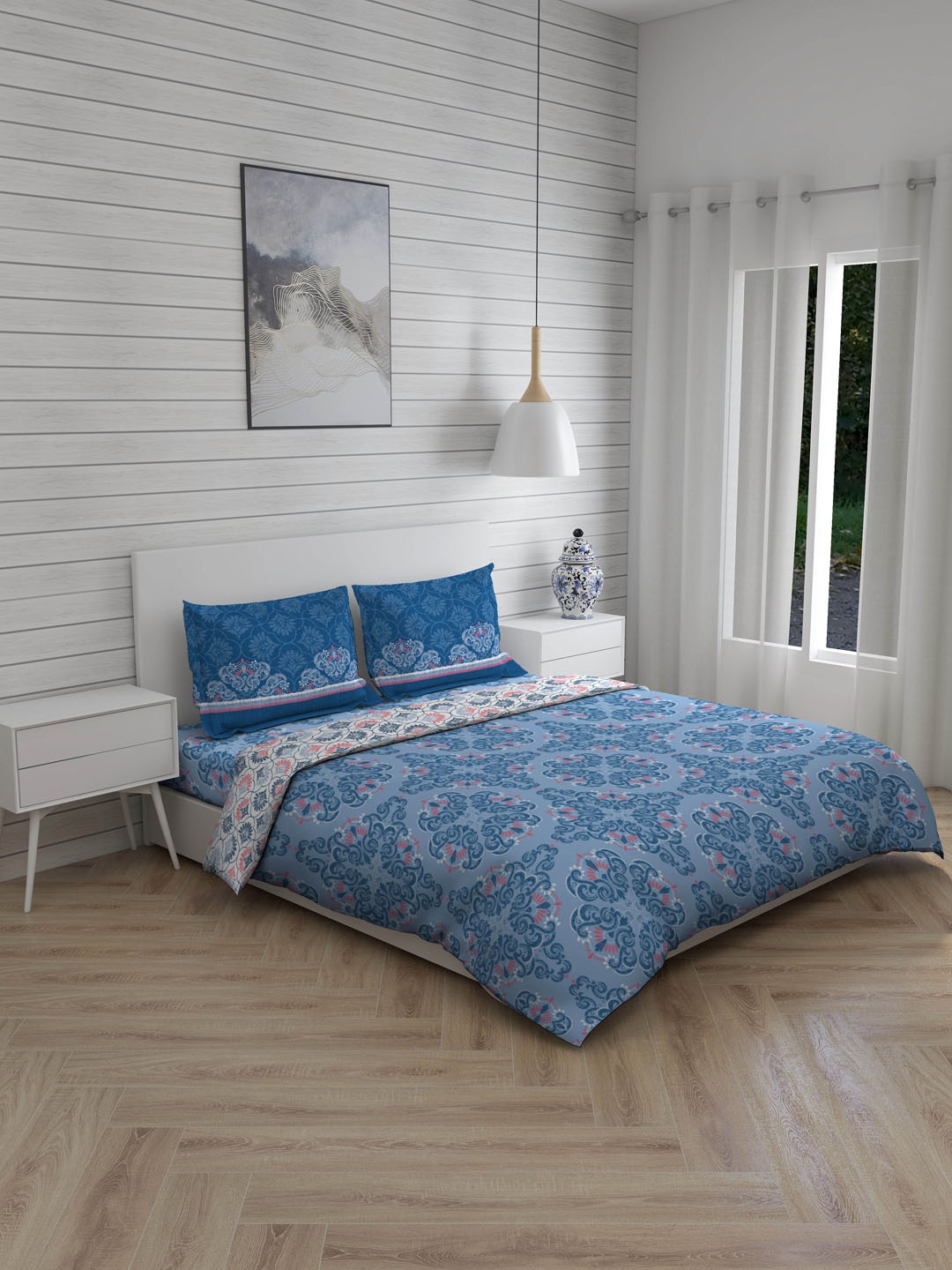 

Layers Blue Printed Double Queen Bedsheet With 2 Pillow Covers & Comforter
