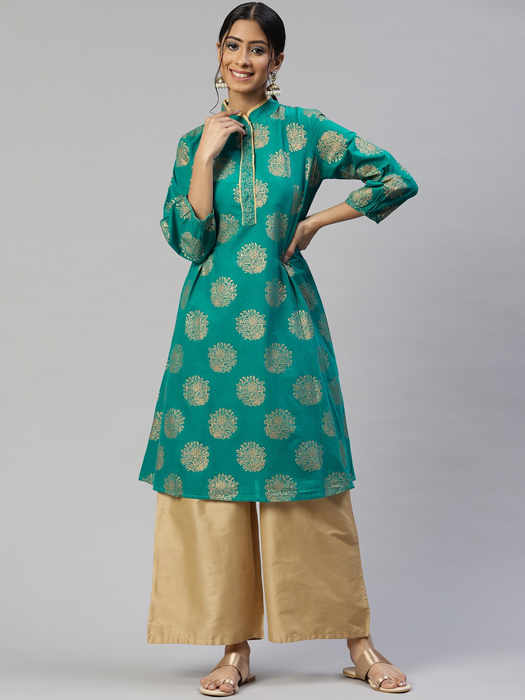 

SVARCHI Women Sea Green & Golden Cotton Ethnic Motifs Printed A-Line Kurta