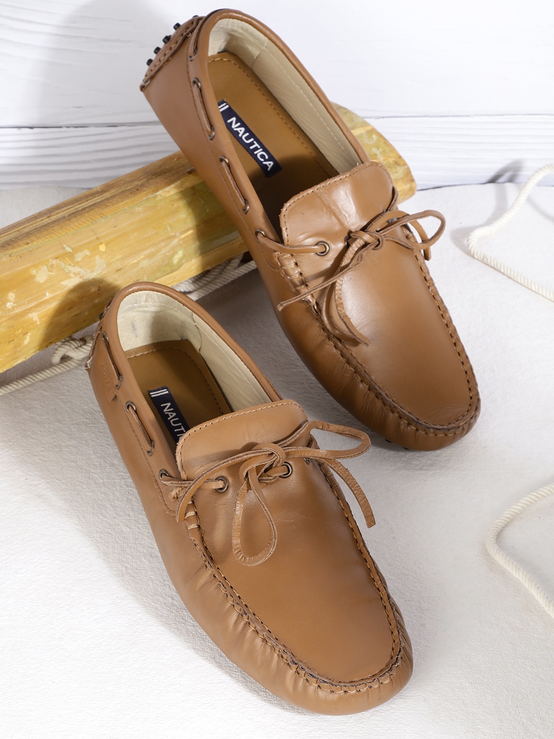 

Nautica Men Brown Solid Leather Boat Driving Shoes with Bows