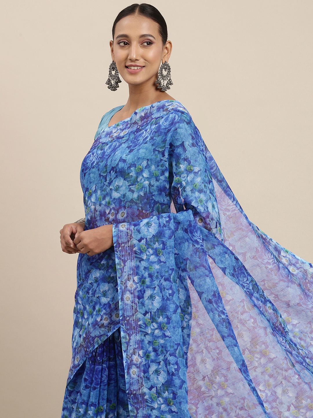 

Rudra Fashion Turquoise Blue Floral Printed Ikat Saree