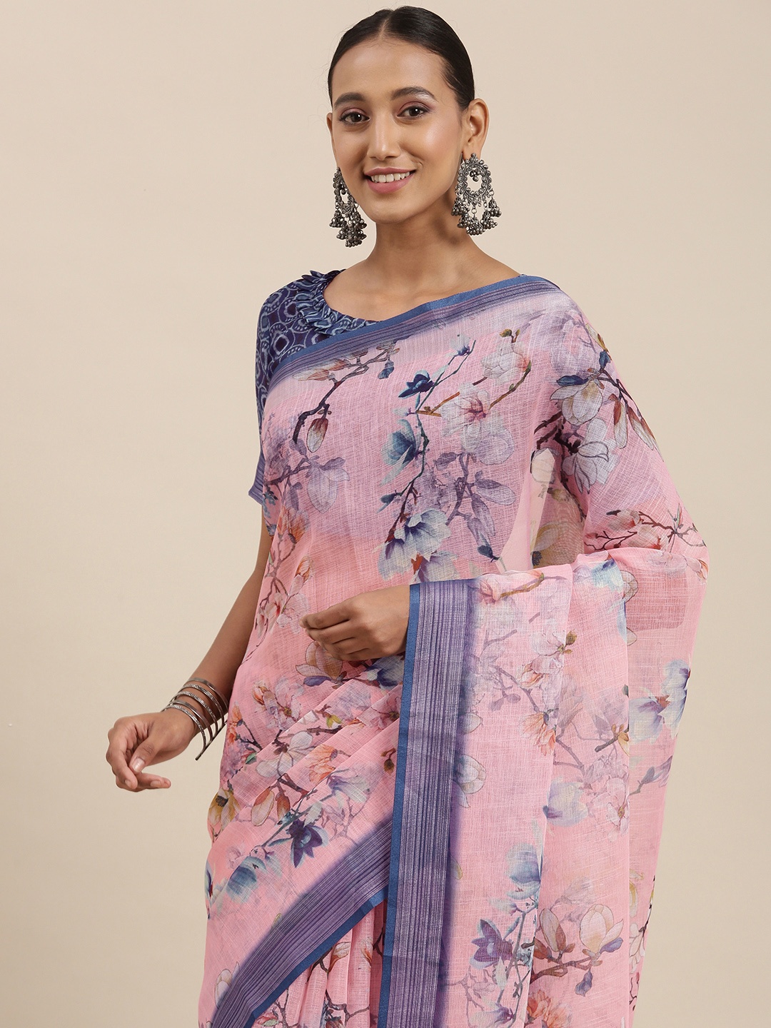 

Rudra Fashion Peach-Coloured & Blue Floral Printed Ikat Saree