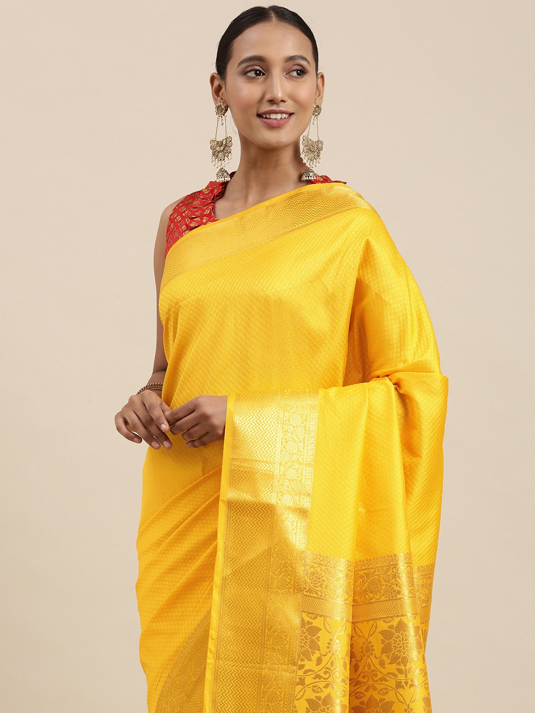 

Rudra Fashion Yellow & Gold Floral Woven Design Silk Blend Kanjeevaram Saree