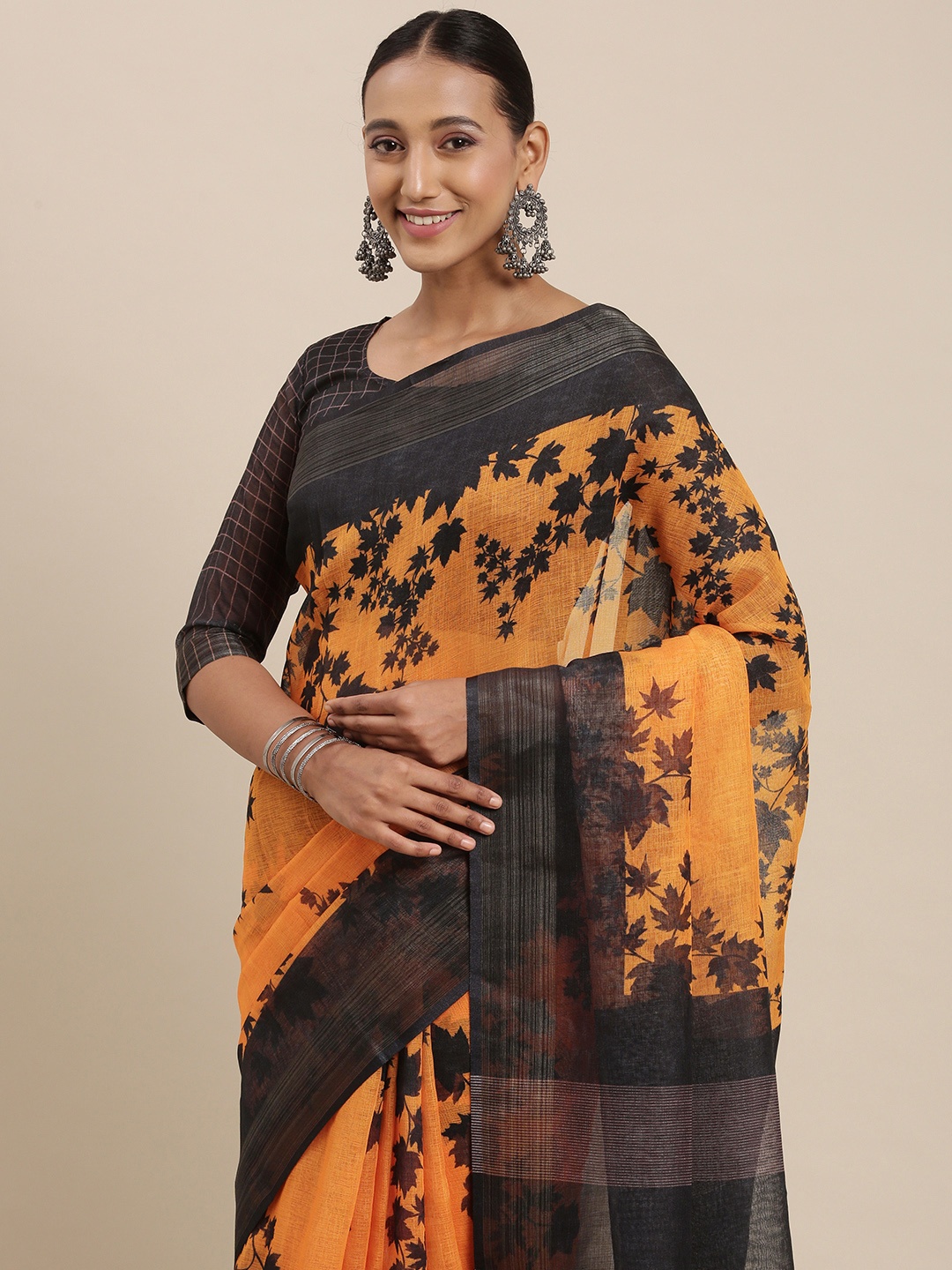 

Rudra Fashion Orange & Black Floral Printed Ikat Saree