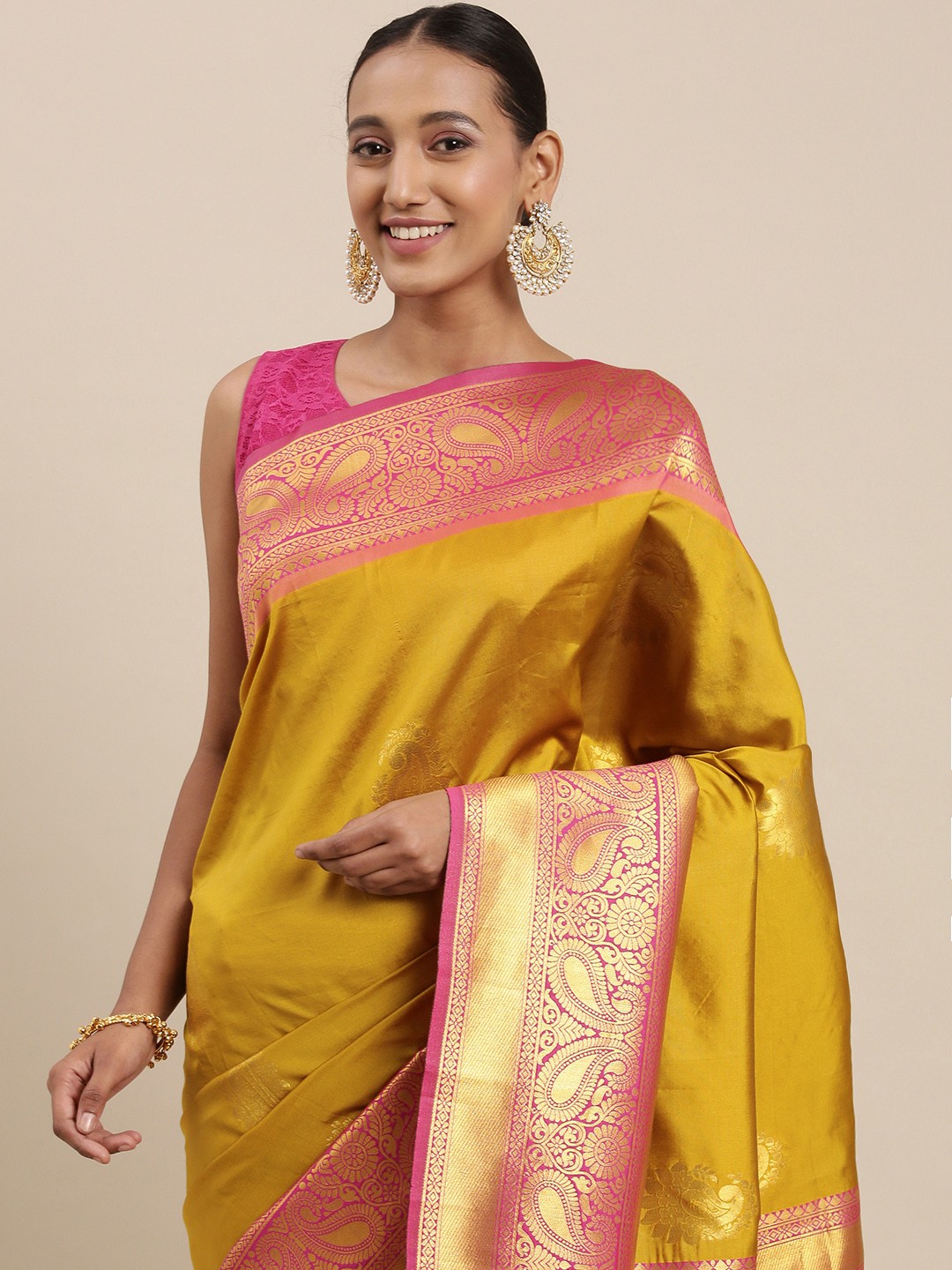

Rudra Fashion Mustard Yellow & Pink Paisley Woven Design Silk Blend Kanjeevaram Saree