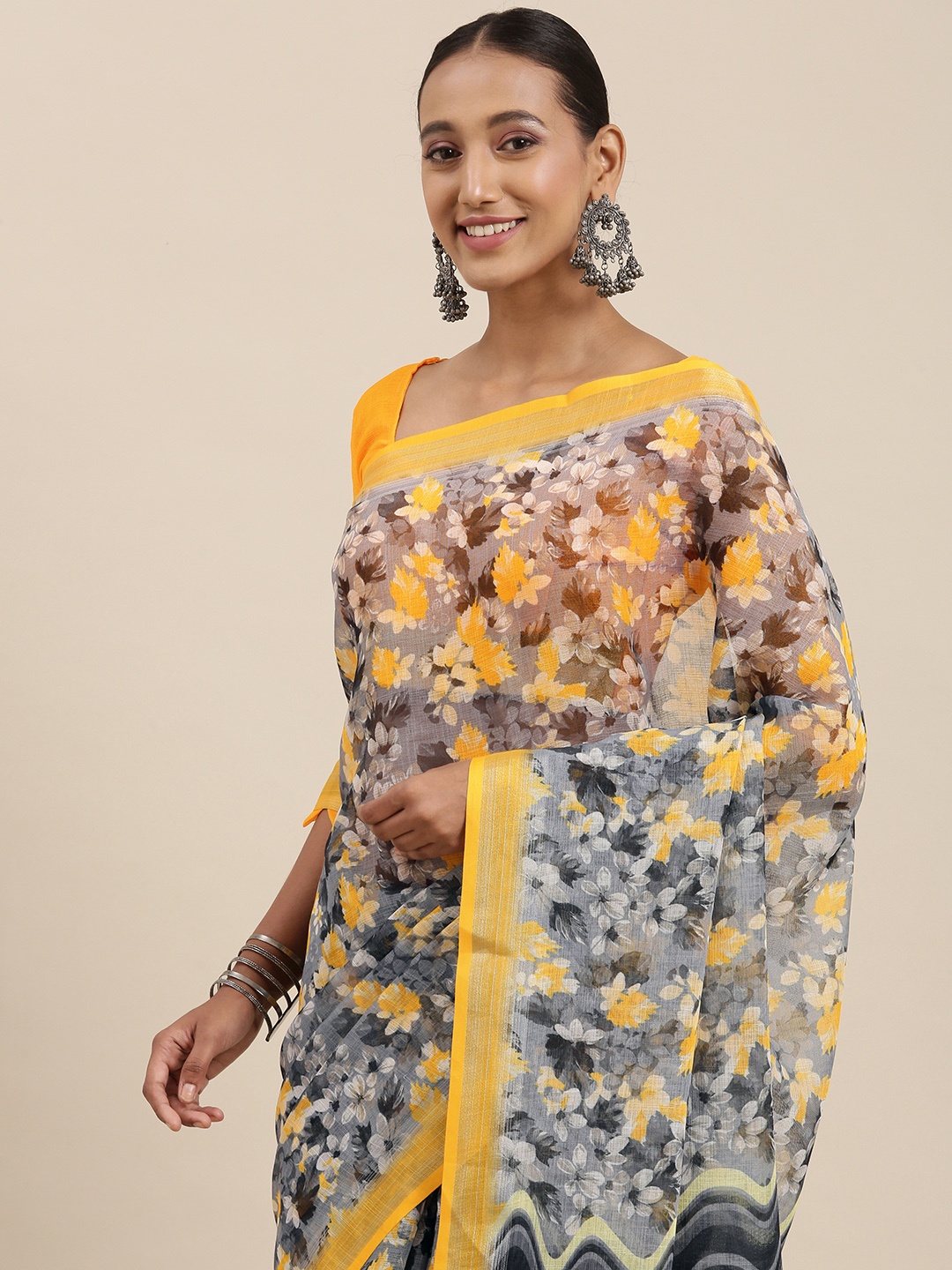 

Rudra Fashion Grey & Yellow Floral Printed Ikat Saree