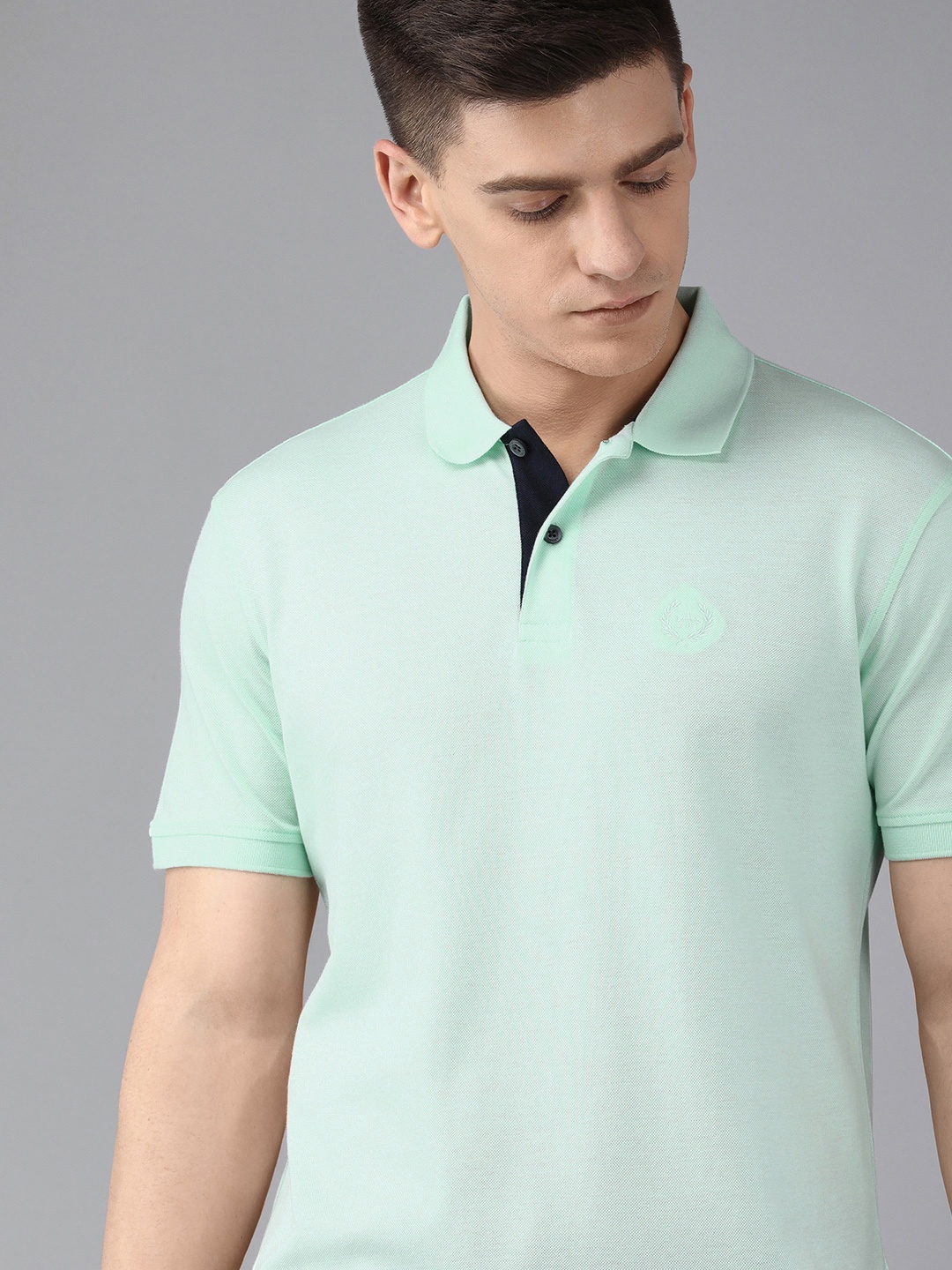 

Arrow Men Blue Solid Pure Cotton Polo Collar T-shirt