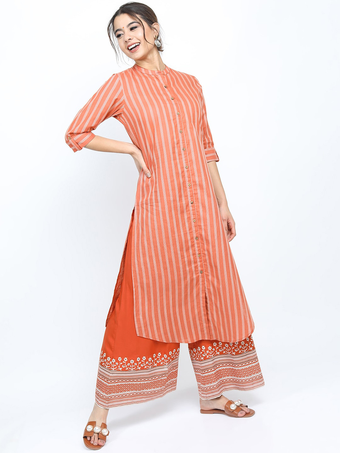 

Vishudh Women Rust Striped Pure Cotton Kurta with Palazzos
