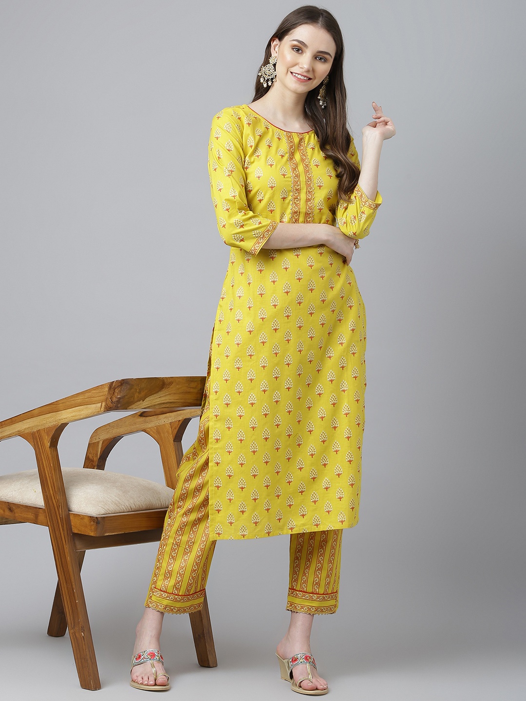 

Kiana Women Yellow Printed Pure Cotton Kurta with Trousers