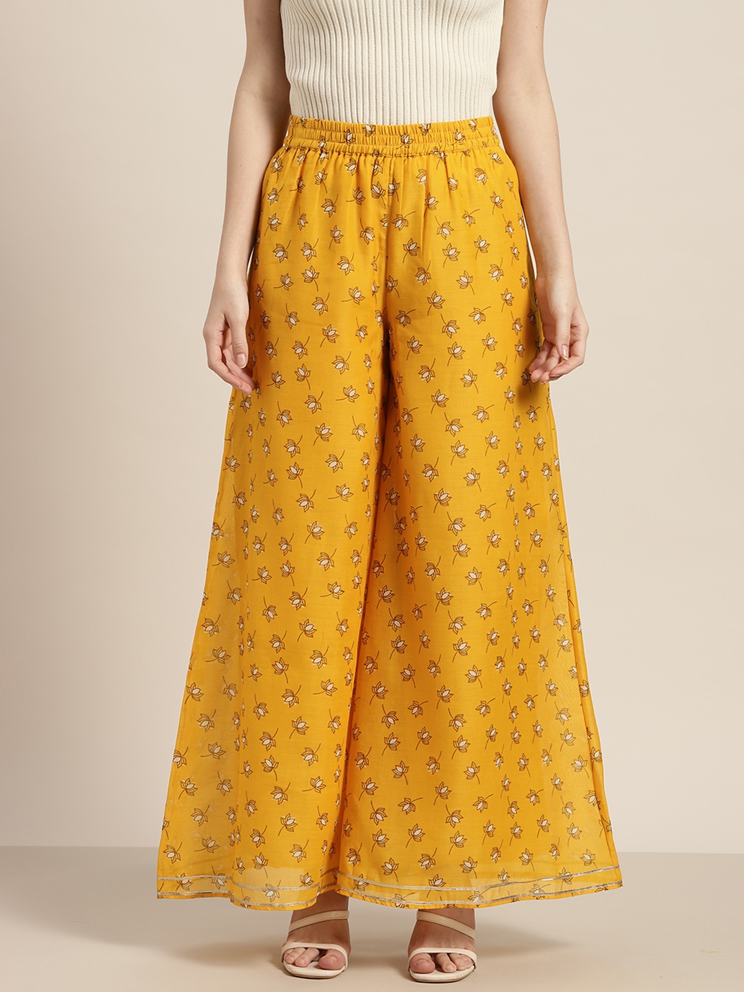 

Shae by SASSAFRAS Women Mustard Yellow & Coffee Brown Floral Printed Flared Palazzos