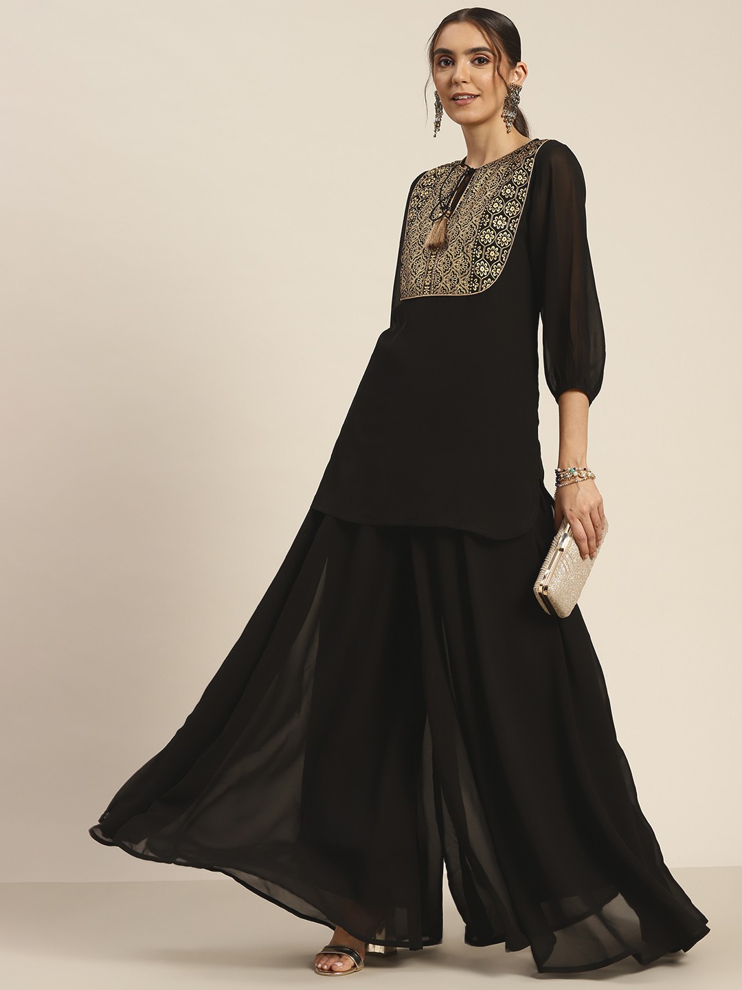 

Shae by SASSAFRAS Women Black Solid Flared Palazzos