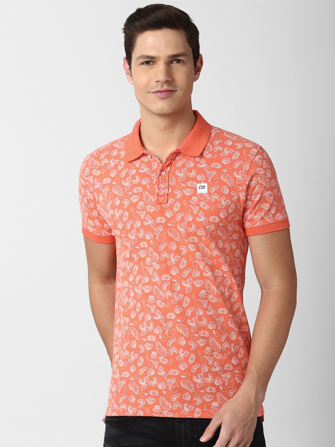 

Peter England Casuals Men Orange Floral Printed Polo Collar Slim Fit Cotton T-shirt