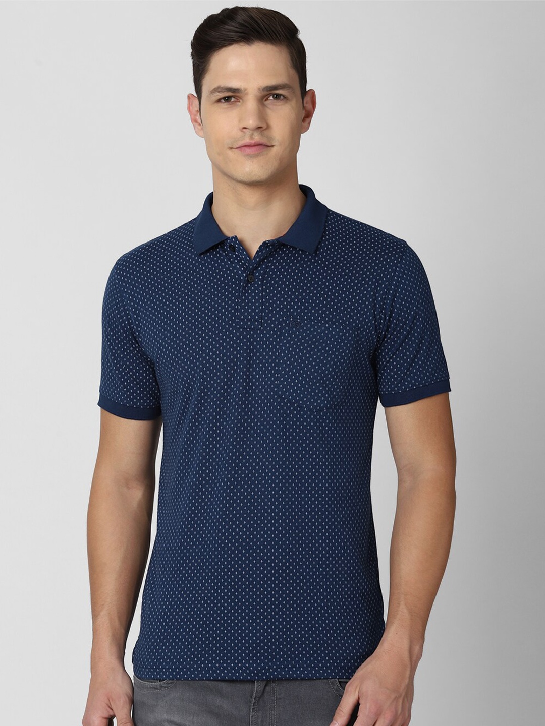 

Peter England Casuals Men Navy Blue Micro Ditsy Printed Polo Collar T-shirt