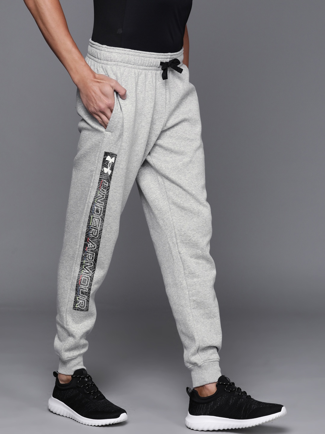 

UNDER ARMOUR Men Grey Melange Typography Printed RIVAL FLC GRAPHIC Joggers