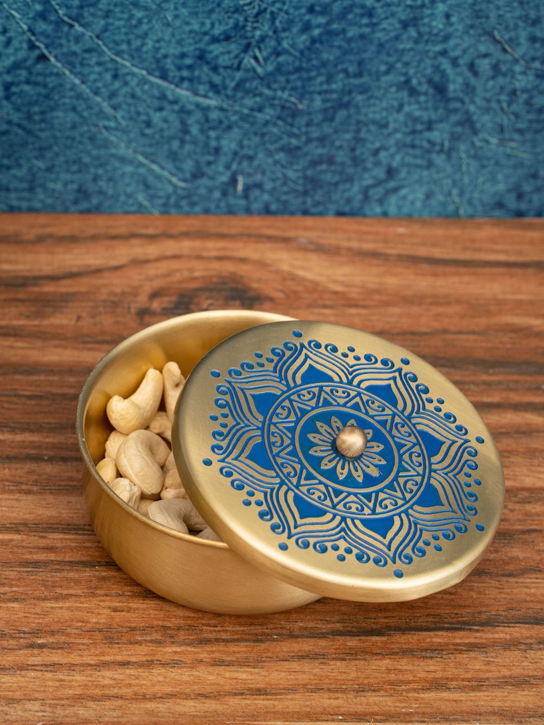 

nakshikathaa Gold-Toned & Blue Printed Brass Nut Container