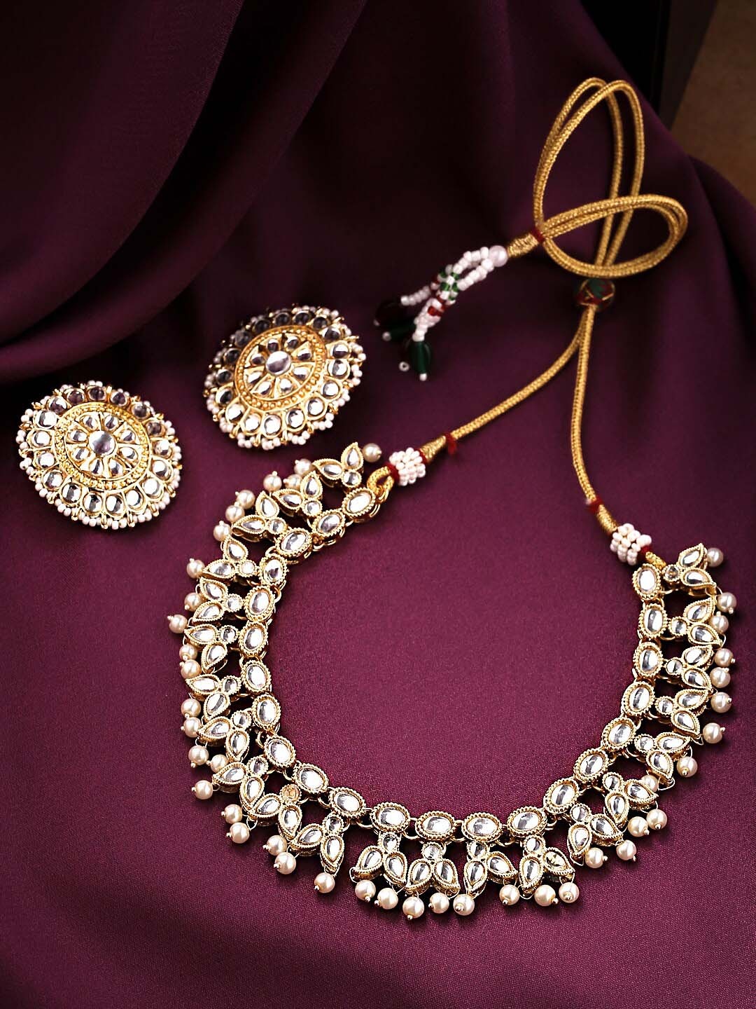 

Yellow Chimes Women Gold-Plated & White Kundan-Studded Beaded Jewellery Set