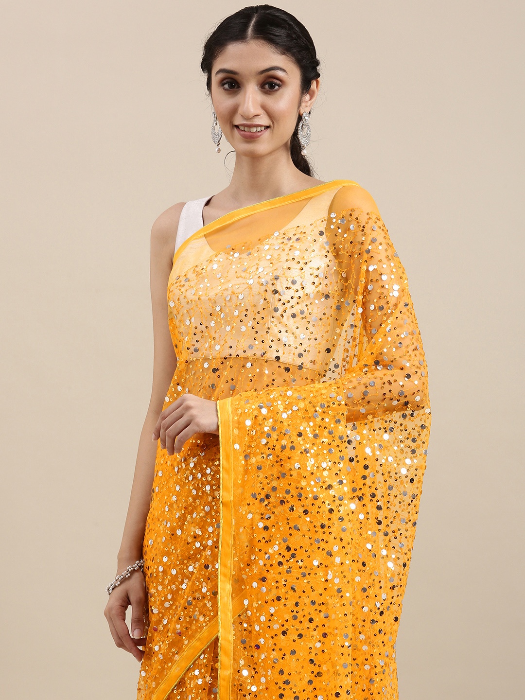 

VASTRANAND Mustard Yellow Embellished Sequinned Net Saree