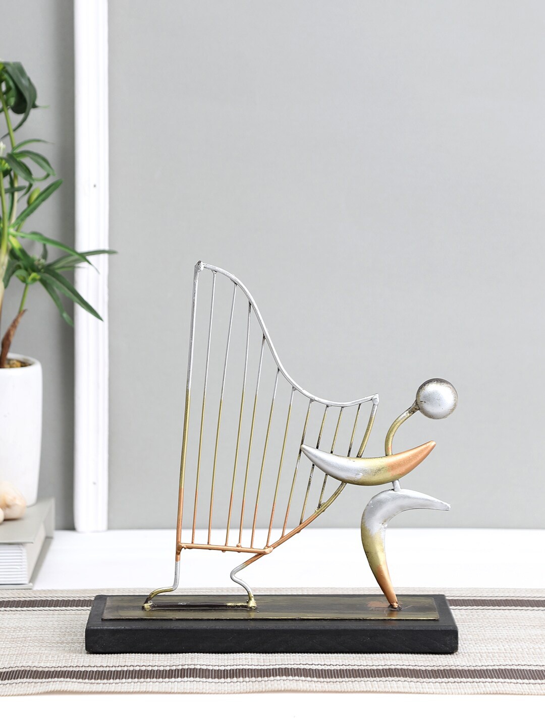 

Aapno Rajasthan Gold-Toned & Silver-Toned Harp Abstract Showpiece
