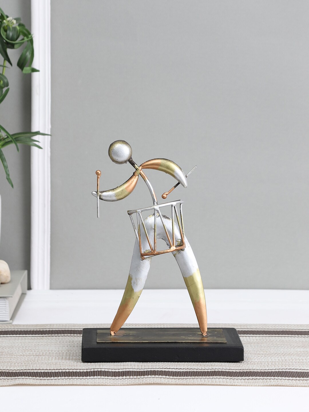 

Aapno Rajasthan Gold-Toned & Silver-Toned Hand Drum Abstract Showpiece