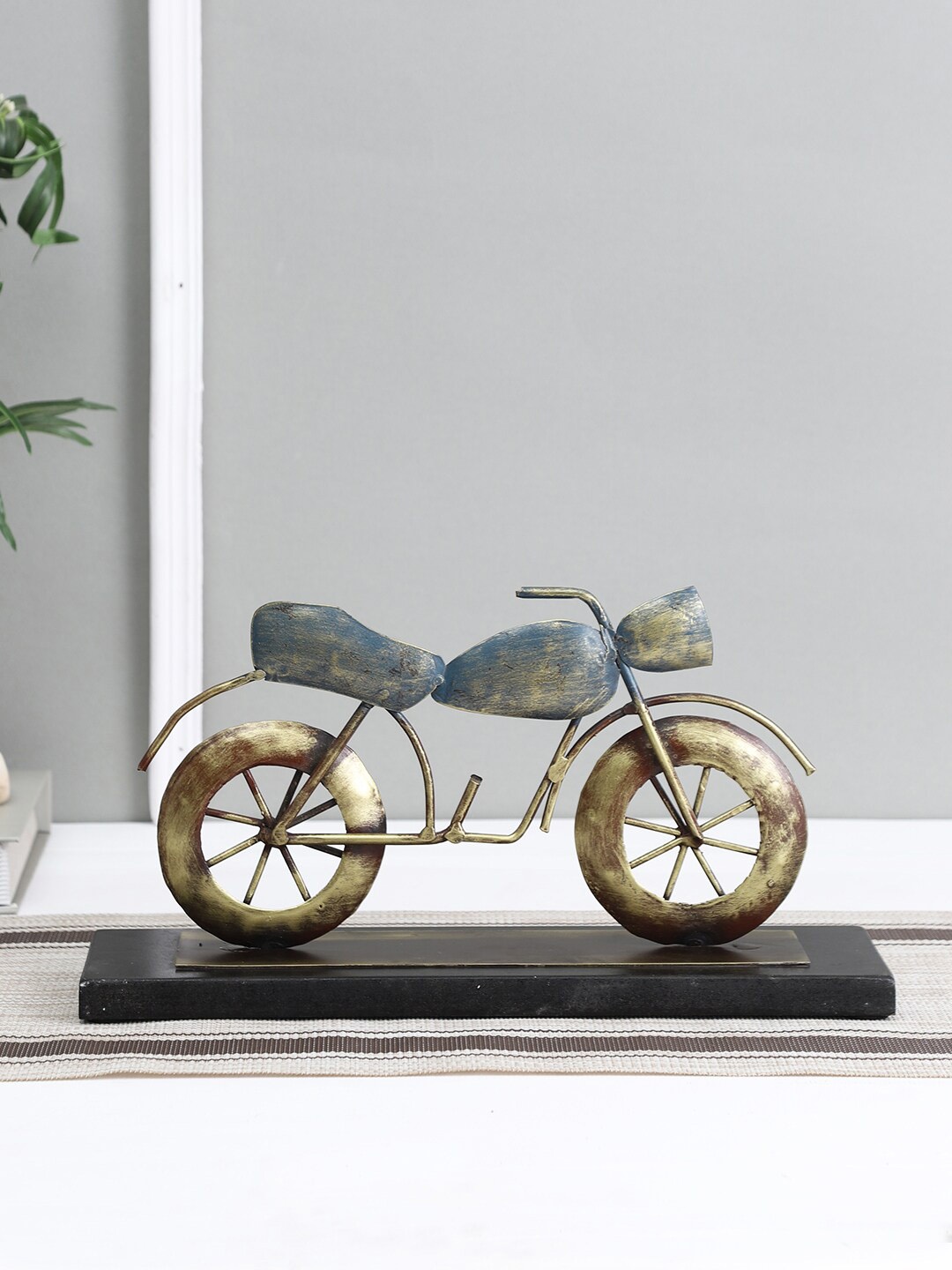 

Aapno Rajasthan Gold-Toned & Blue Punk Bike Table Decor Showpiece