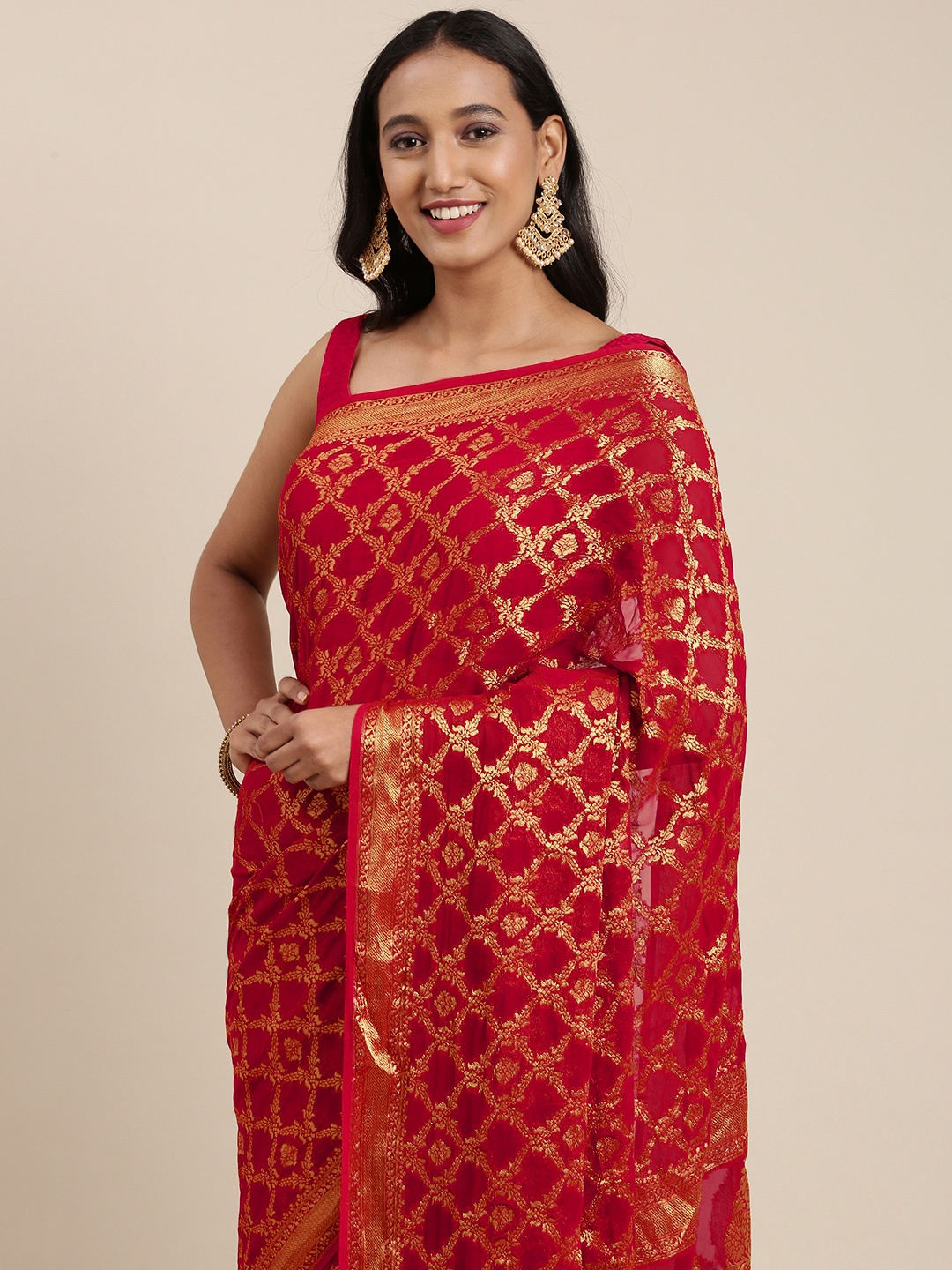 

Geroo Jaipur Red & Golden Ethnic Motifs Zari Pure Georgette Banarasi Saree