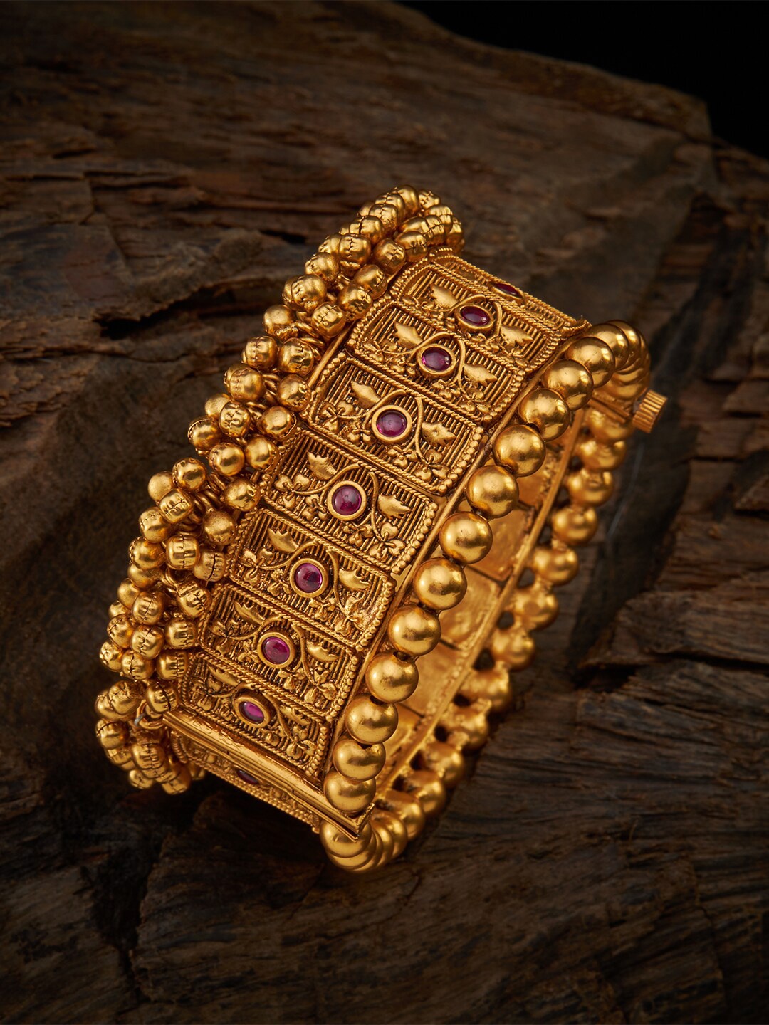 

Kushal's Fashion Jewellery Gold-Plated & Red-Studded Ghungroo Detailed Bangle