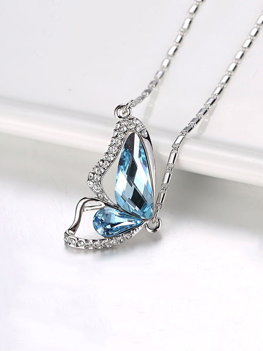 

Yellow Chimes Silver-Toned Blue Stone-Studded Butterfly Pendant With Chain