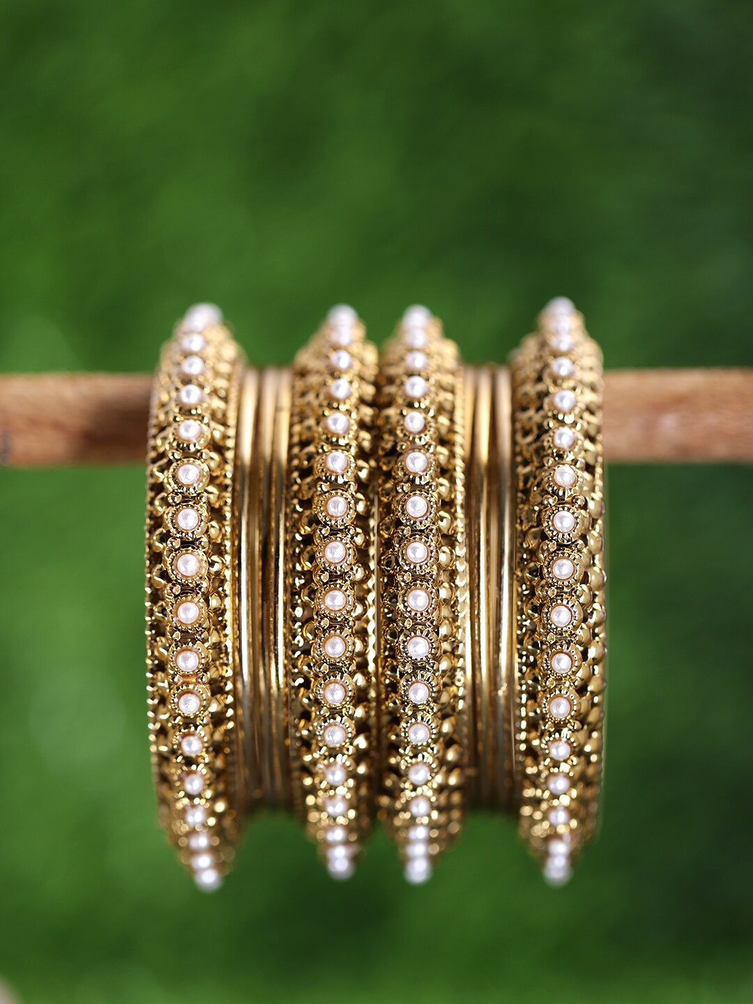 

Yellow Chimes Set Of 10 Gold-Plated White Pearl Bangles