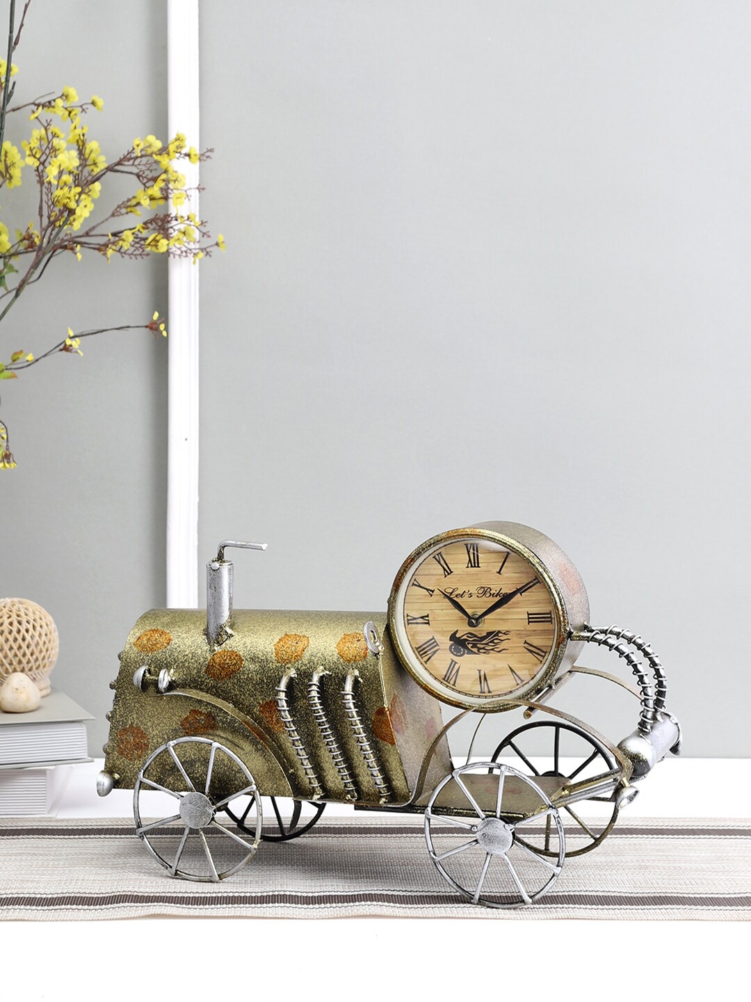 

Aapno Rajasthan Gold-Toned & Steel Printed Abstract Shaped Contemporary Table Clock