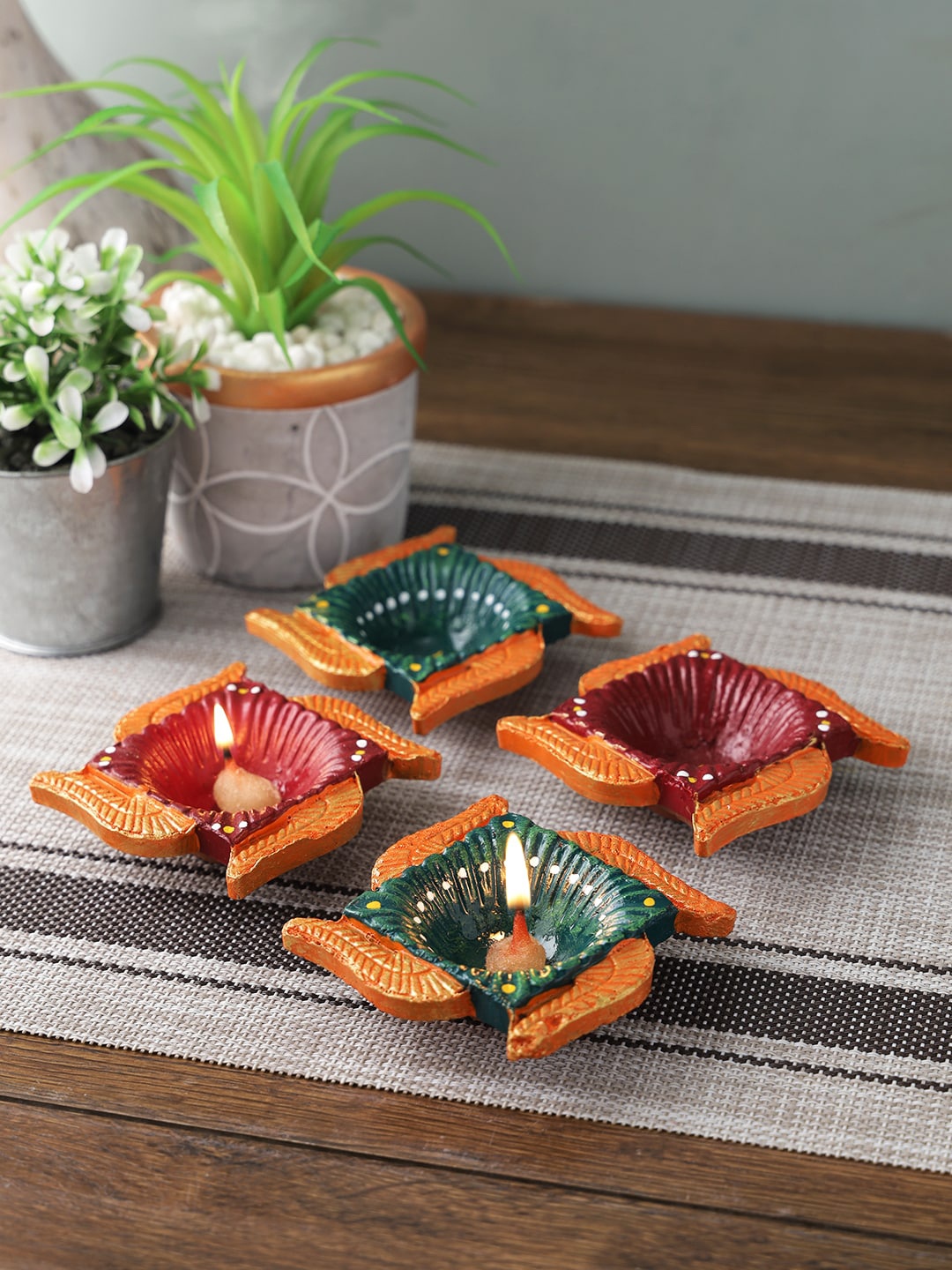 

Aapno Rajasthan Set of 4 Multicoloured Teracotta Swastik Diyas, Multi