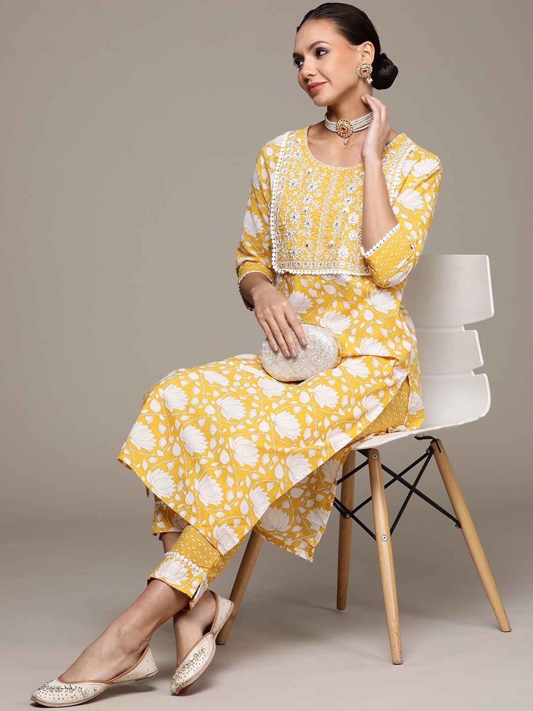 

Ishin Women Yellow Floral Yoke Design Pure Cotton Kurta with Trousers