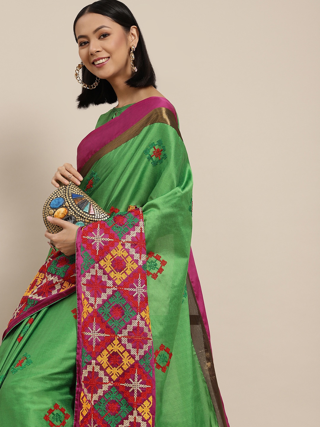 

Mitera Green & Maroon Embellished Kutchi Embroidery Saree