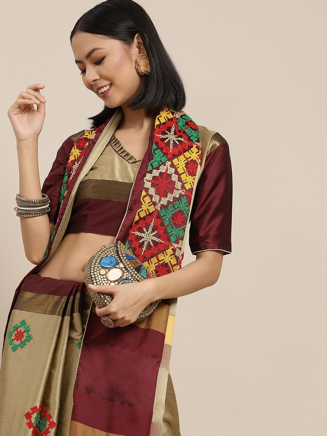 

Mitera Beige & Maroon Embellished Kutchi Embroidery Saree