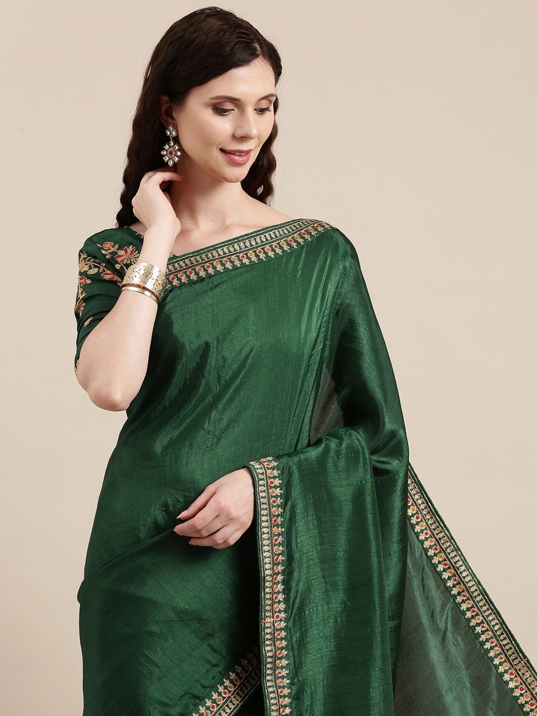 

VAIRAGEE Green Solid Embroidered Border Saree