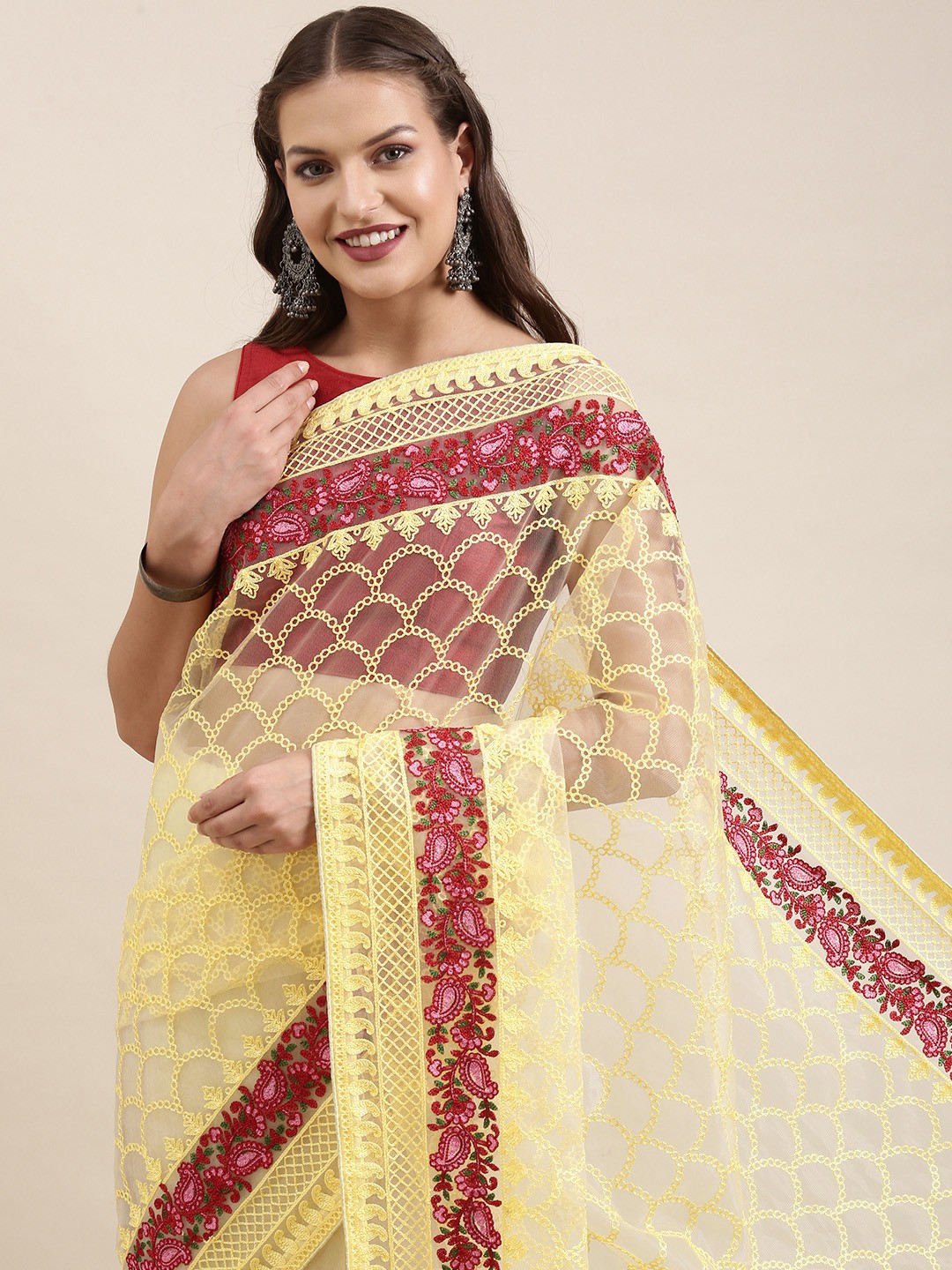 

VAIRAGEE Yellow & Red Ethnic Motifs Embroidered Supernet Saree