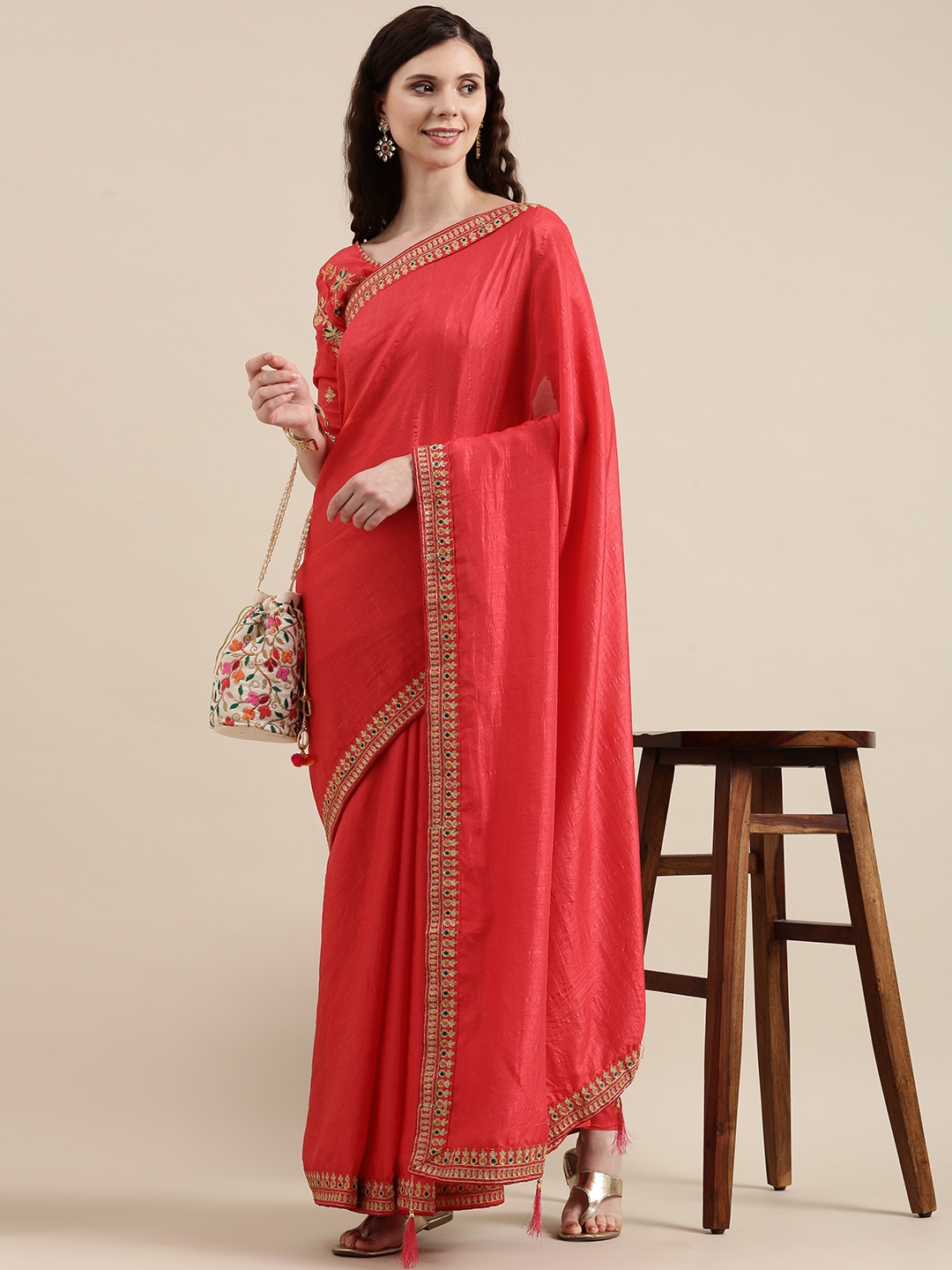

VAIRAGEE Coral Pink Solid Saree