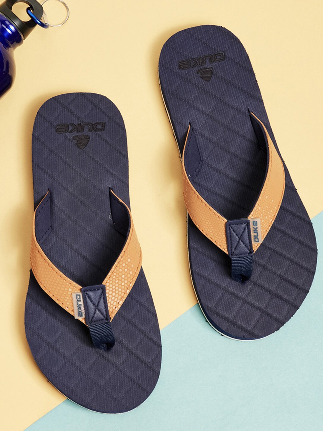 

Duke Women Tan Brown & Navy Blue Textured Thong Flip-Flops