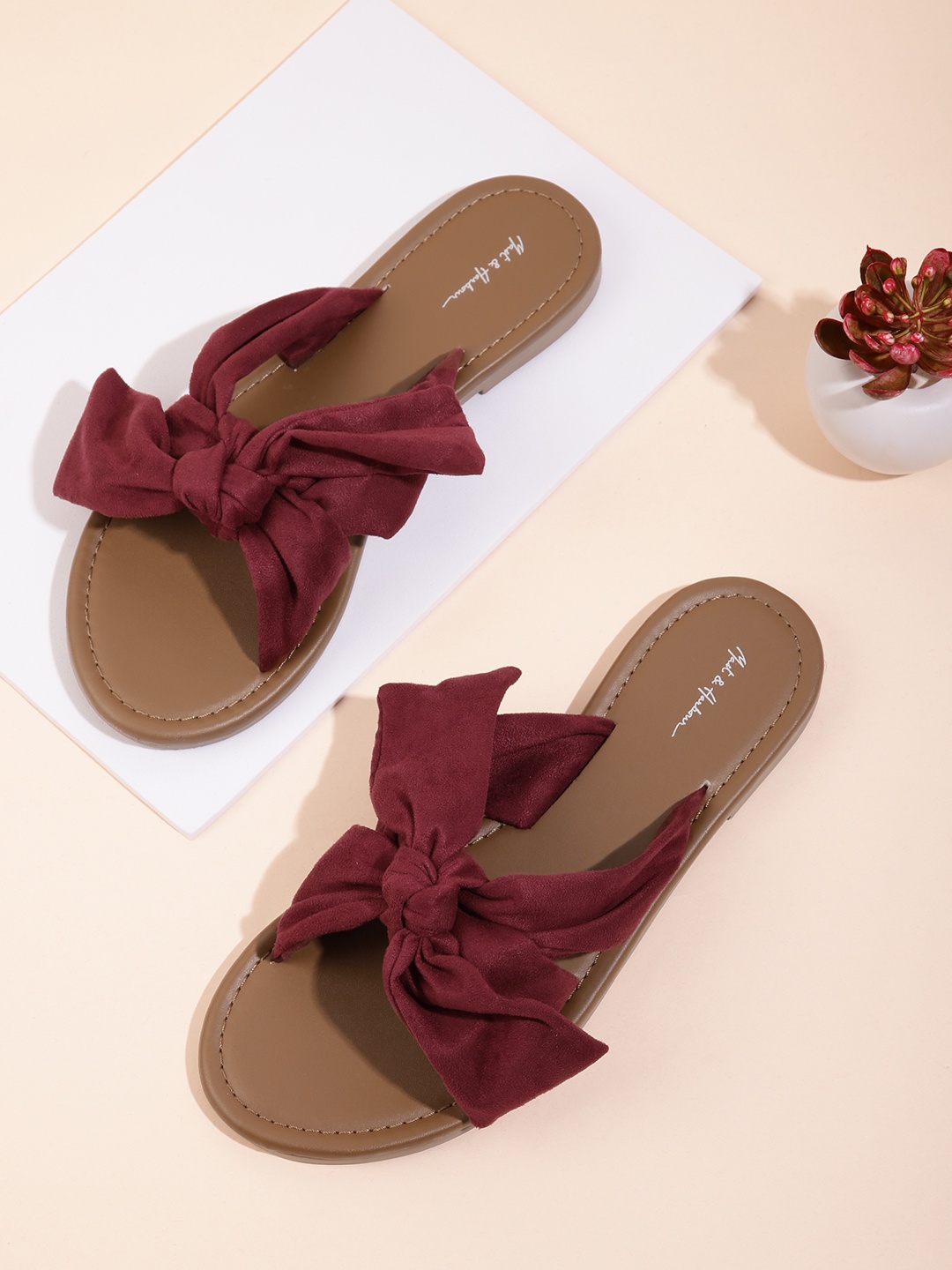 

Mast & Harbour Women Burgundy Solid Suede Finish Open Toe Flats with Bows