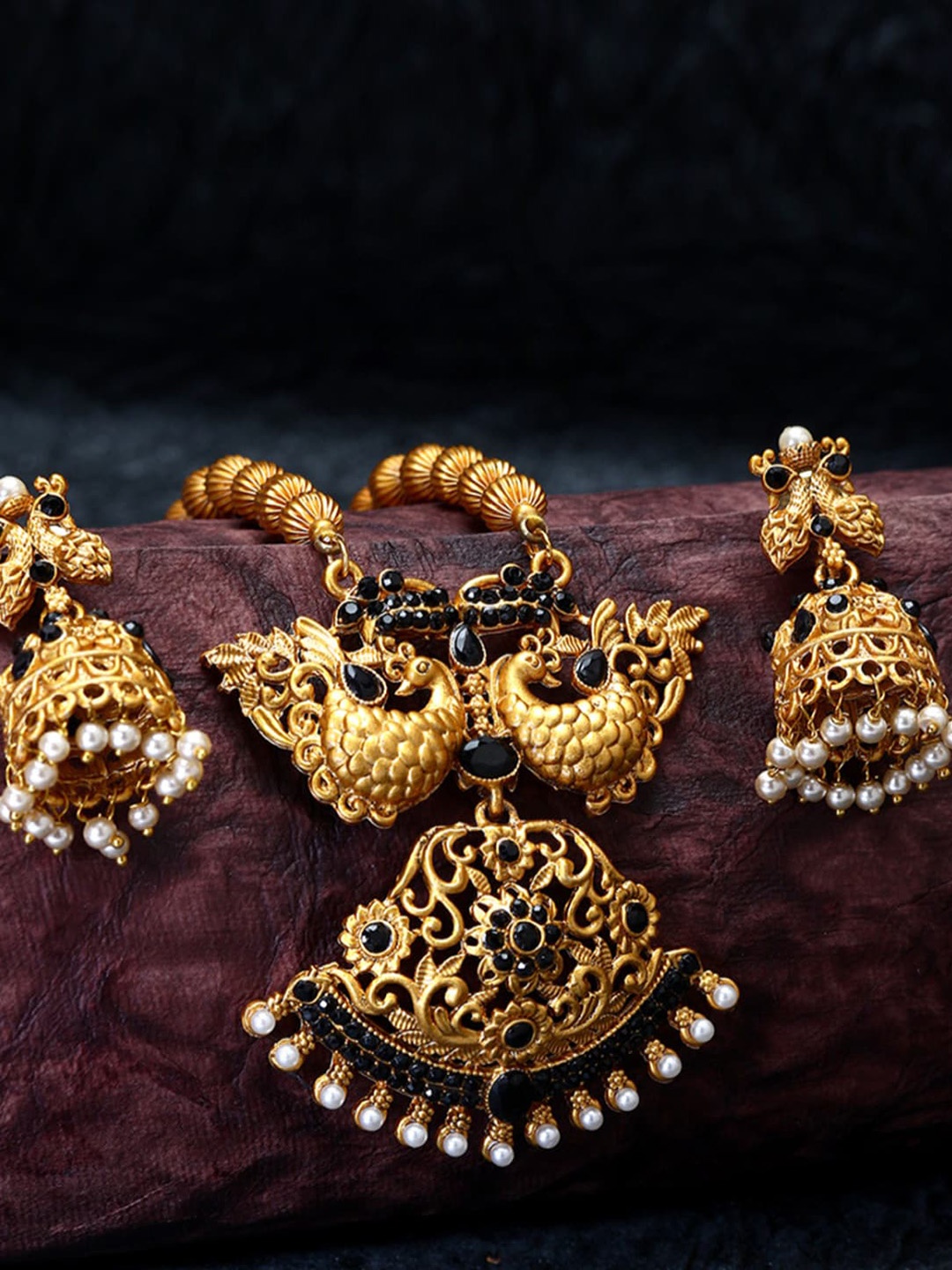 

ANIKAS CREATION Gold- Plated Black Stone Studded & Beaded Temple Jewellery Set