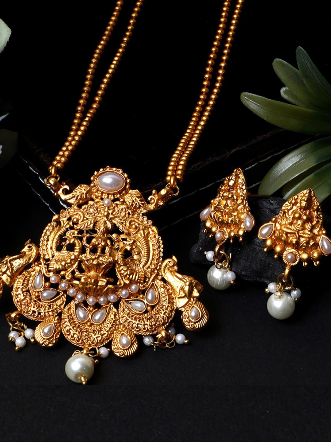 

ANIKAS CREATION Gold-Plated White Stone Studded and Pearl Temple Jewellery Set