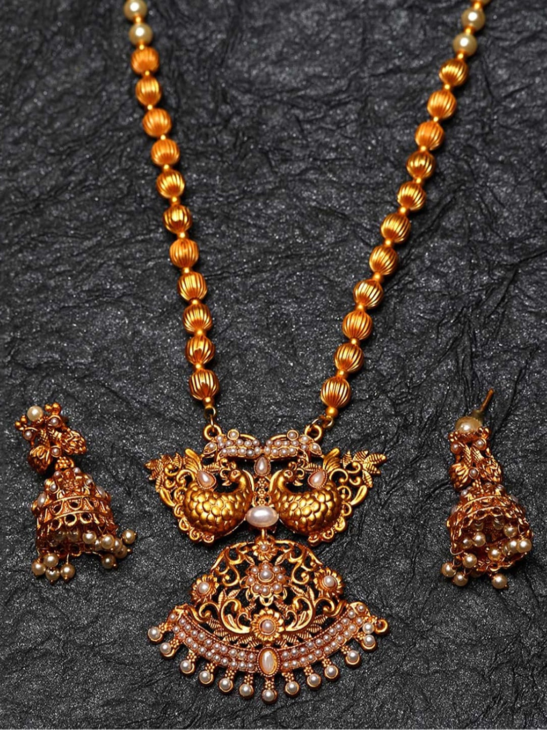 

ANIKAS CREATION Gold-Plated & White Pearl Beaded Peacock Shape Temple Jewellery Set