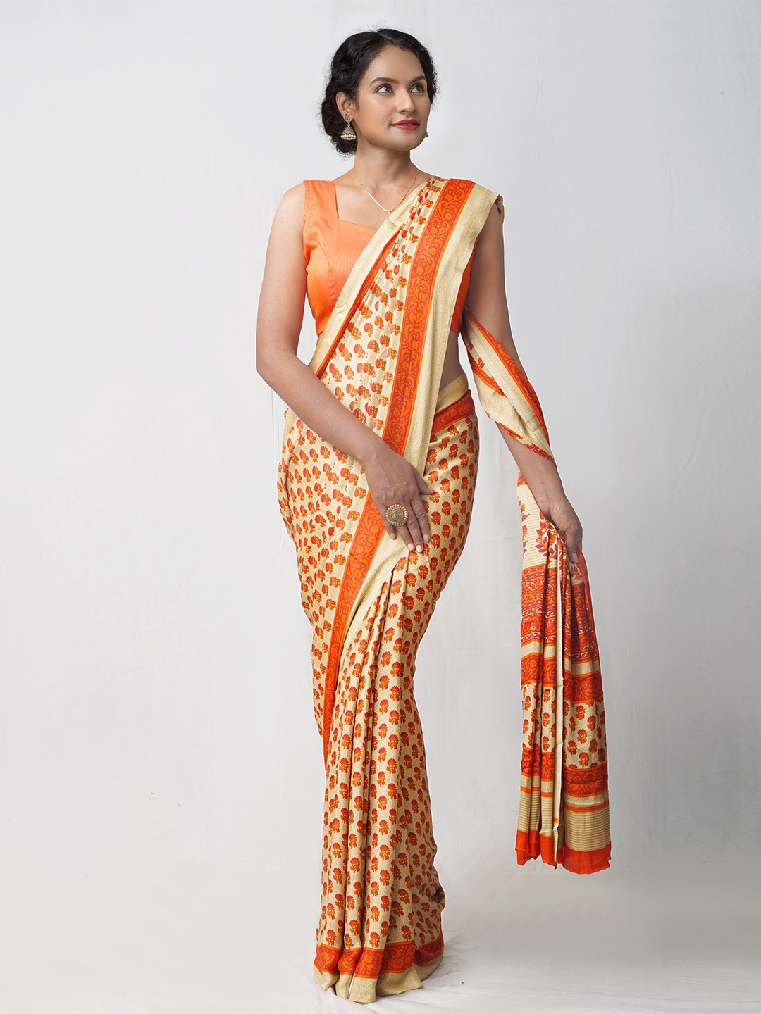 

Unnati Silks Cream-Coloured & Orange Ethnic Motifs Patola Saree