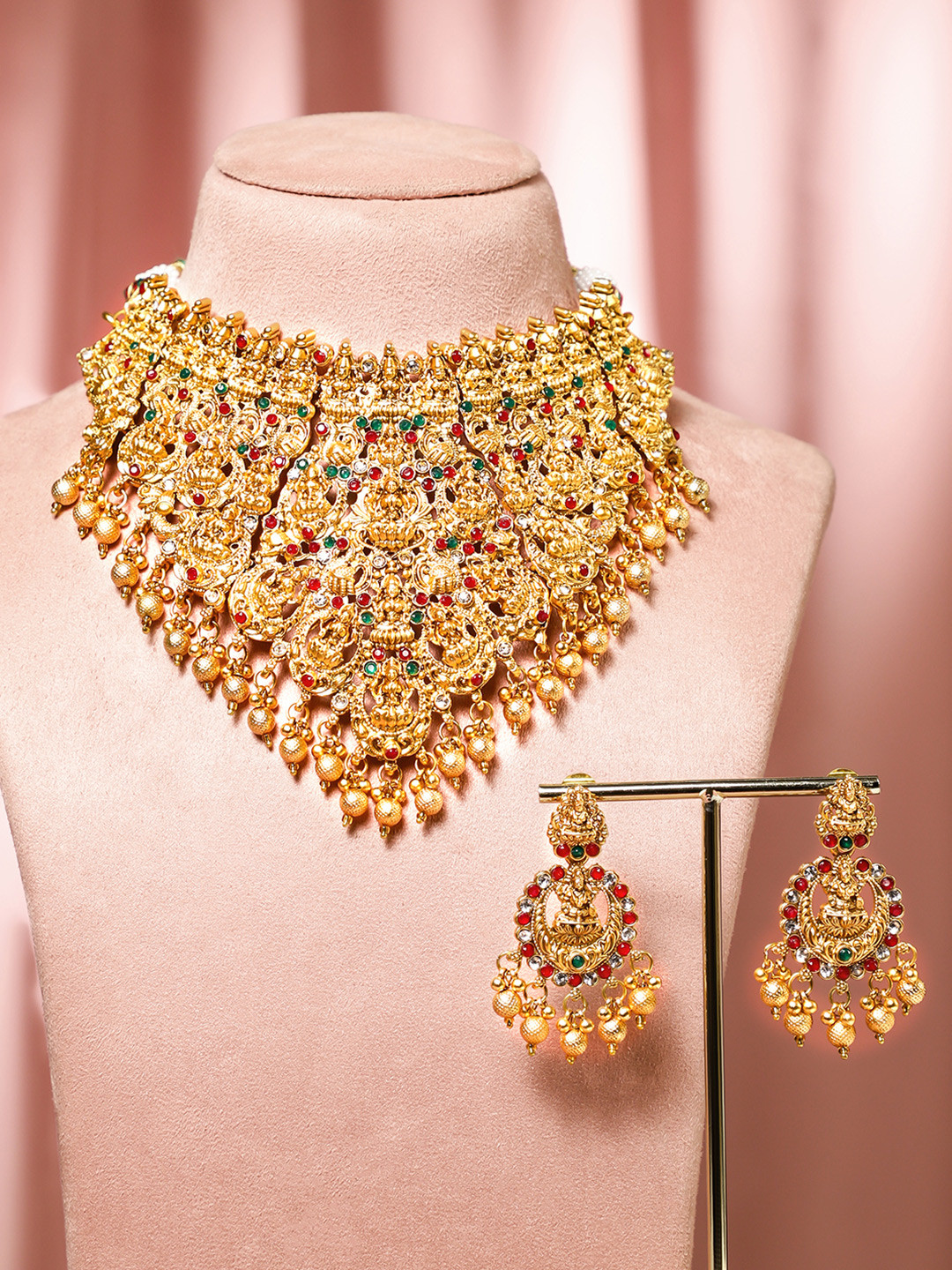 

Rubans 22K Gold Plated Red, Green & White Stone Studded Lakshmi Motif Temple Jewellery Set