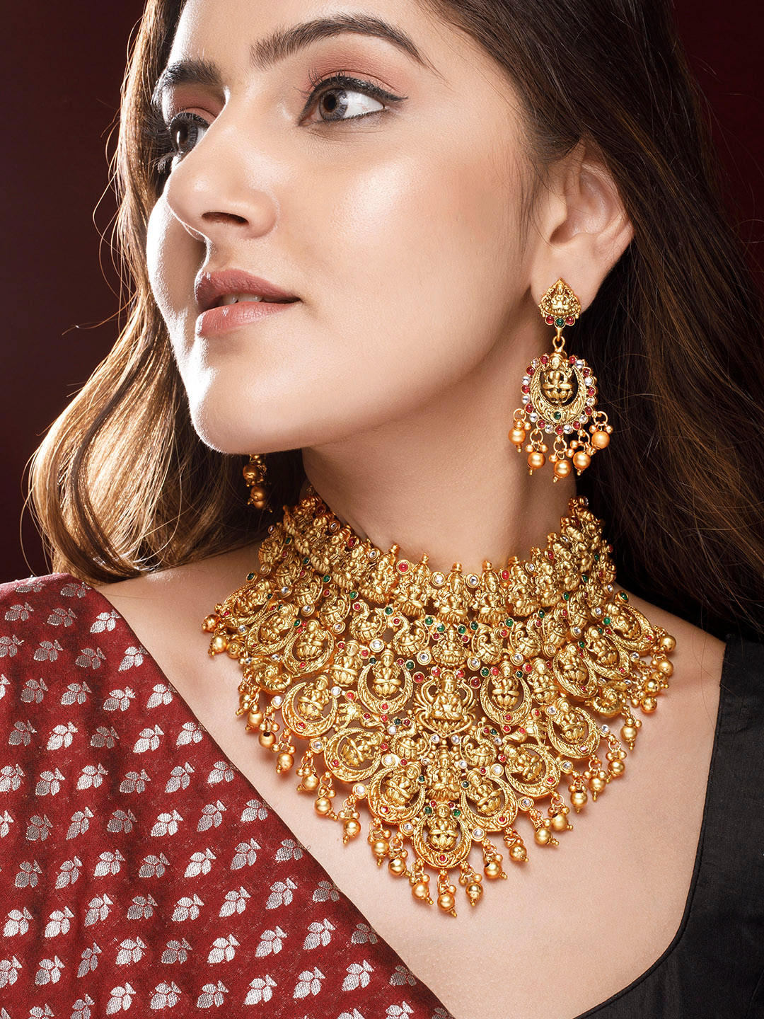 Rubans 22K Gold Plated Red, Green & White Stone Studded Lakshmi Motif Temple Jewellery Set