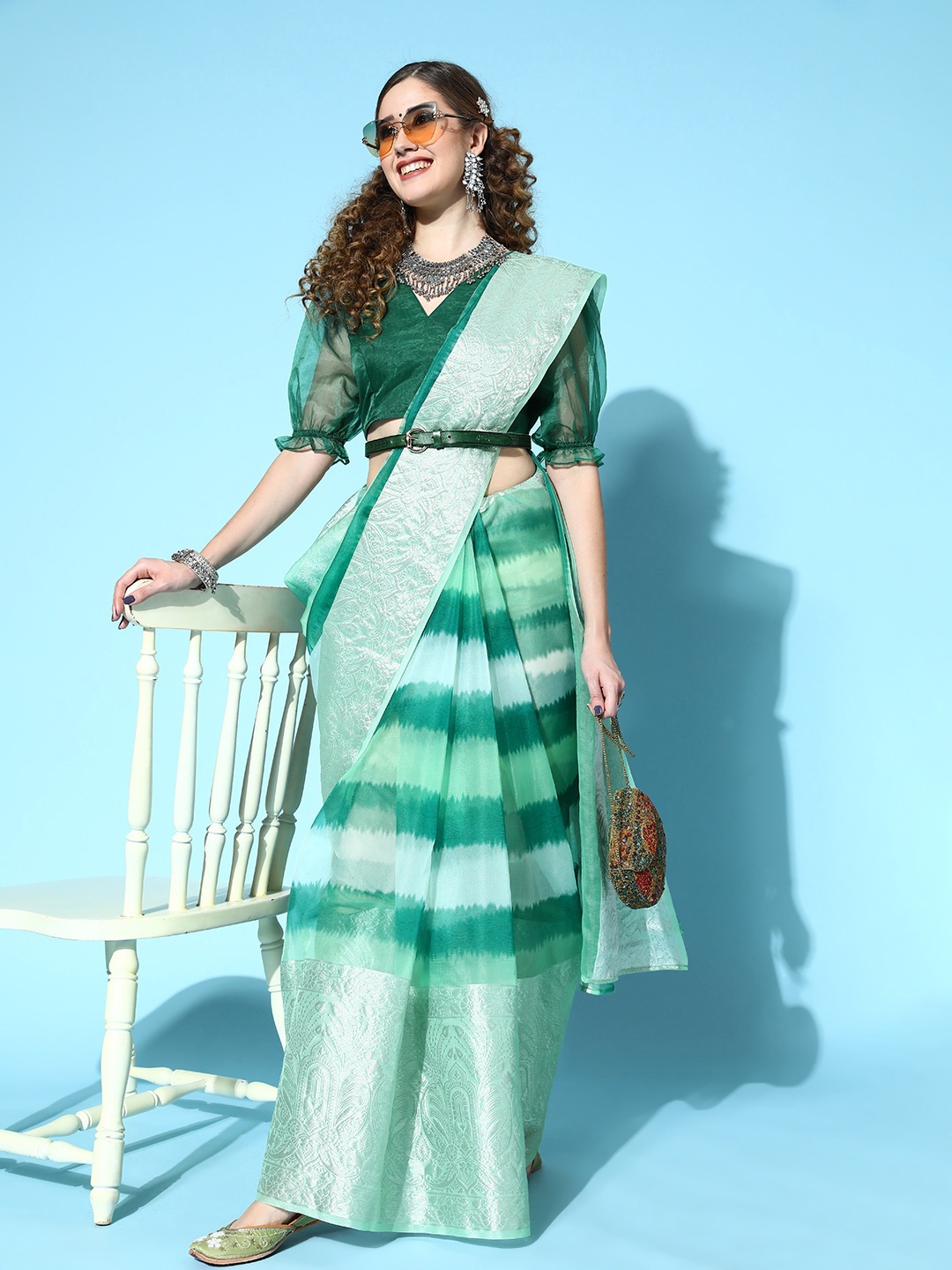 

Inddus Women Green Organza Woven Design Saree with Blouse Piece