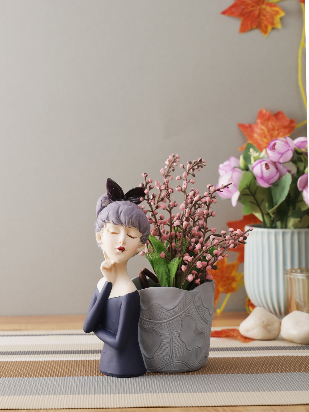 

CraftVatika Multi colored Girl with Basket Showpieces