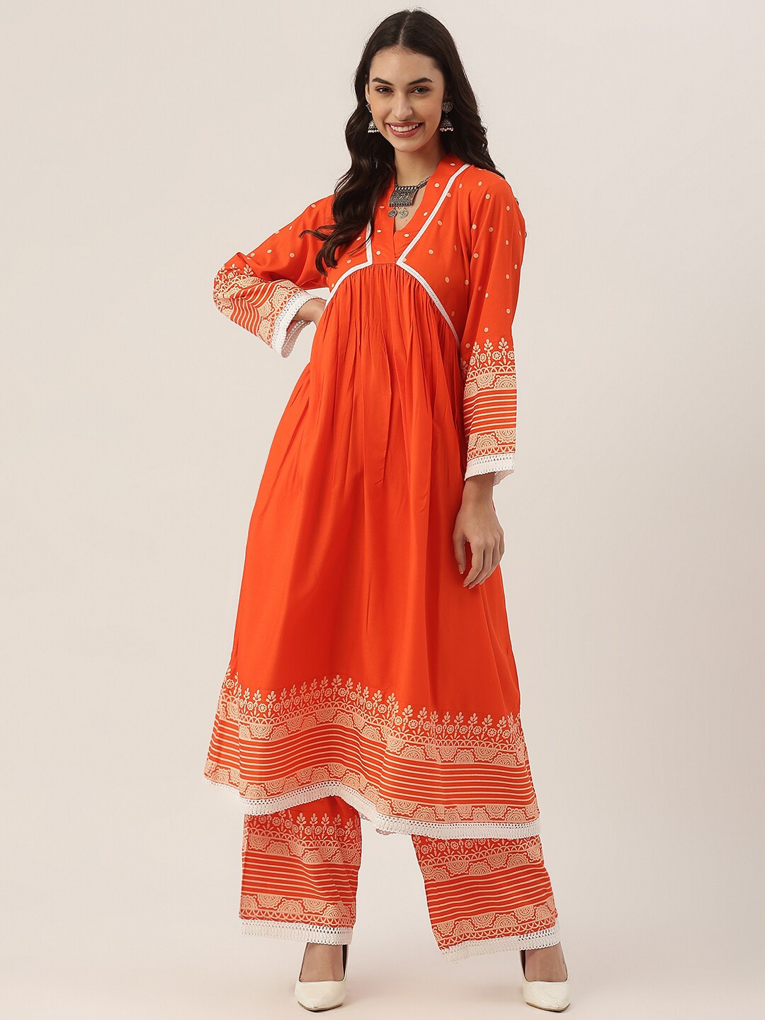 

Rustorange Women Orange Ethnic Motifs Kurta with Palazzos