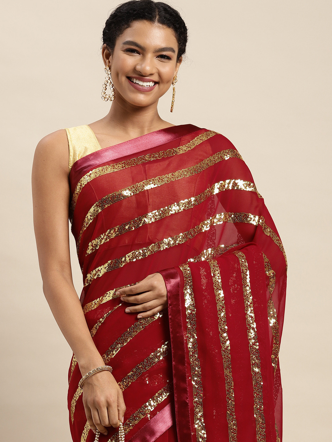 

Mitera Red & Golden Embellished Saree